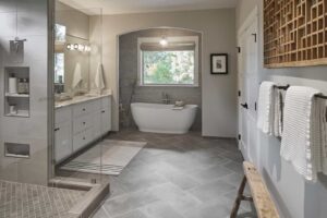 large bathroom with tile, tub and glass enclosed shower