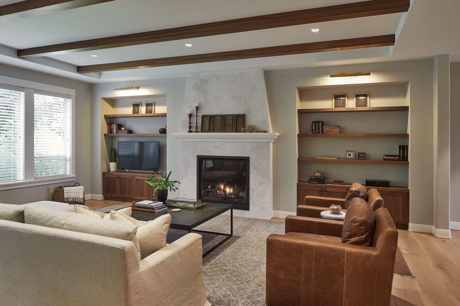 living area with build in fireplace, book shelfs.