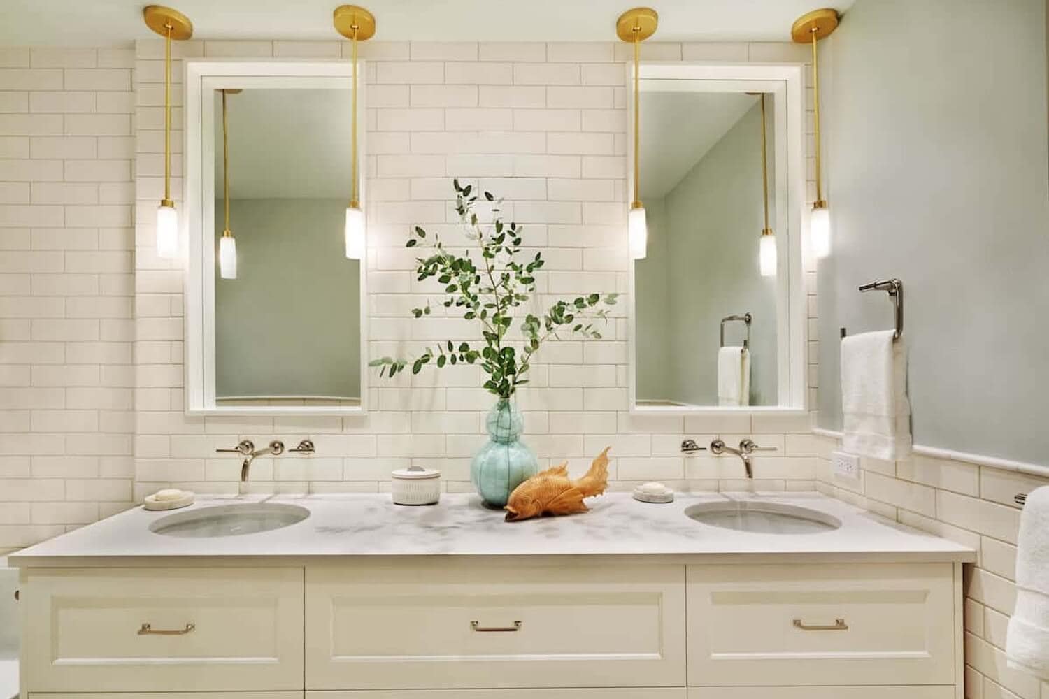 double bathroom vanity and sinks with custom pendant lighting